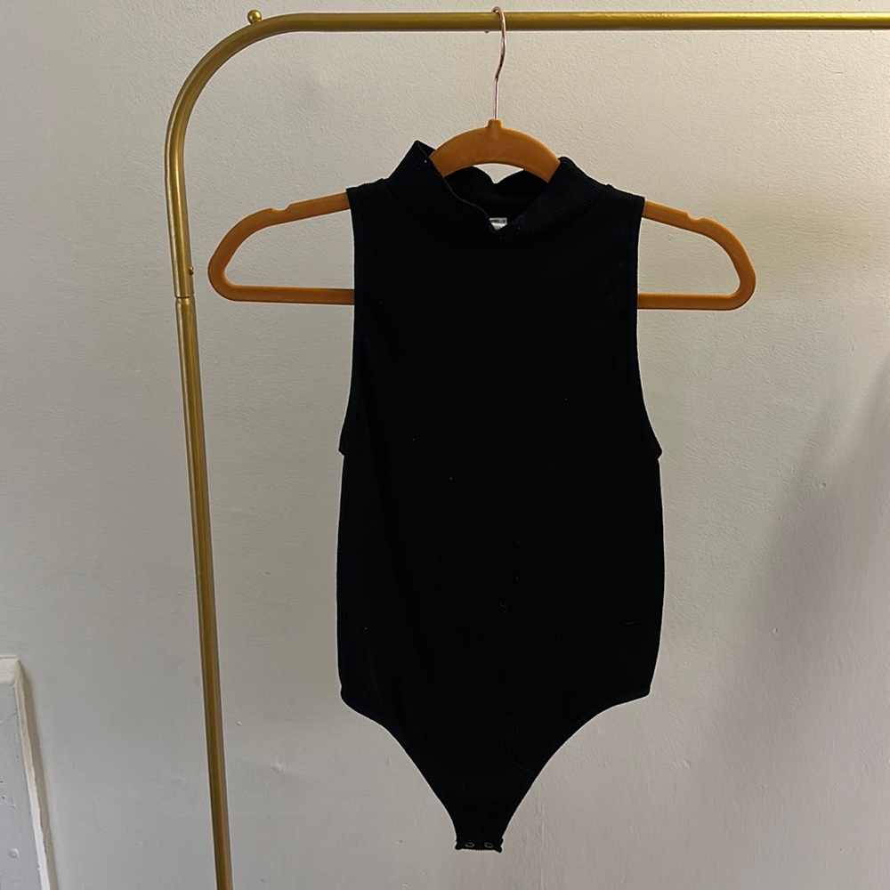 Black Sleeveless Turtleneck Onesie.